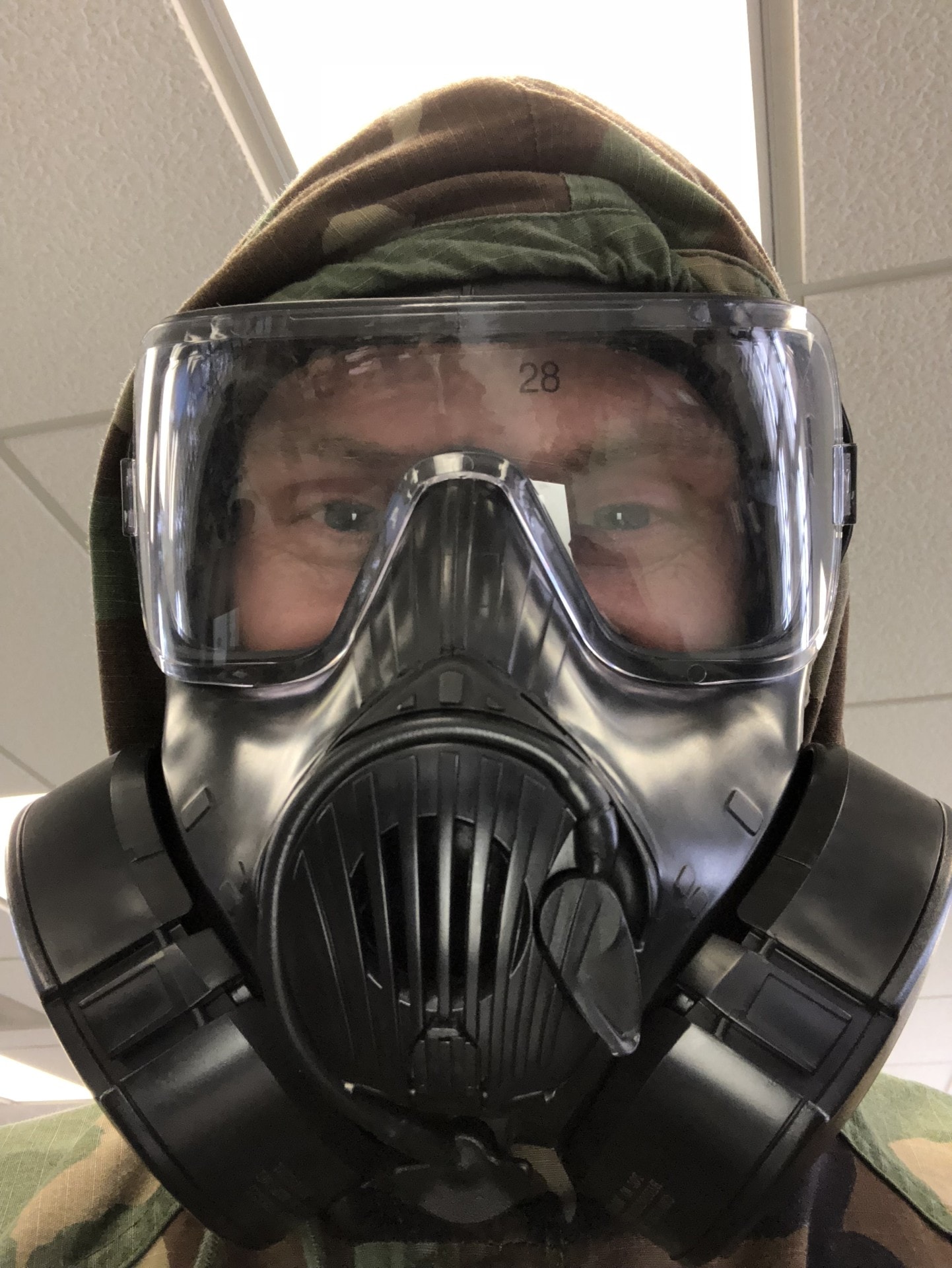 Service member in MOPP gear during training exercise
